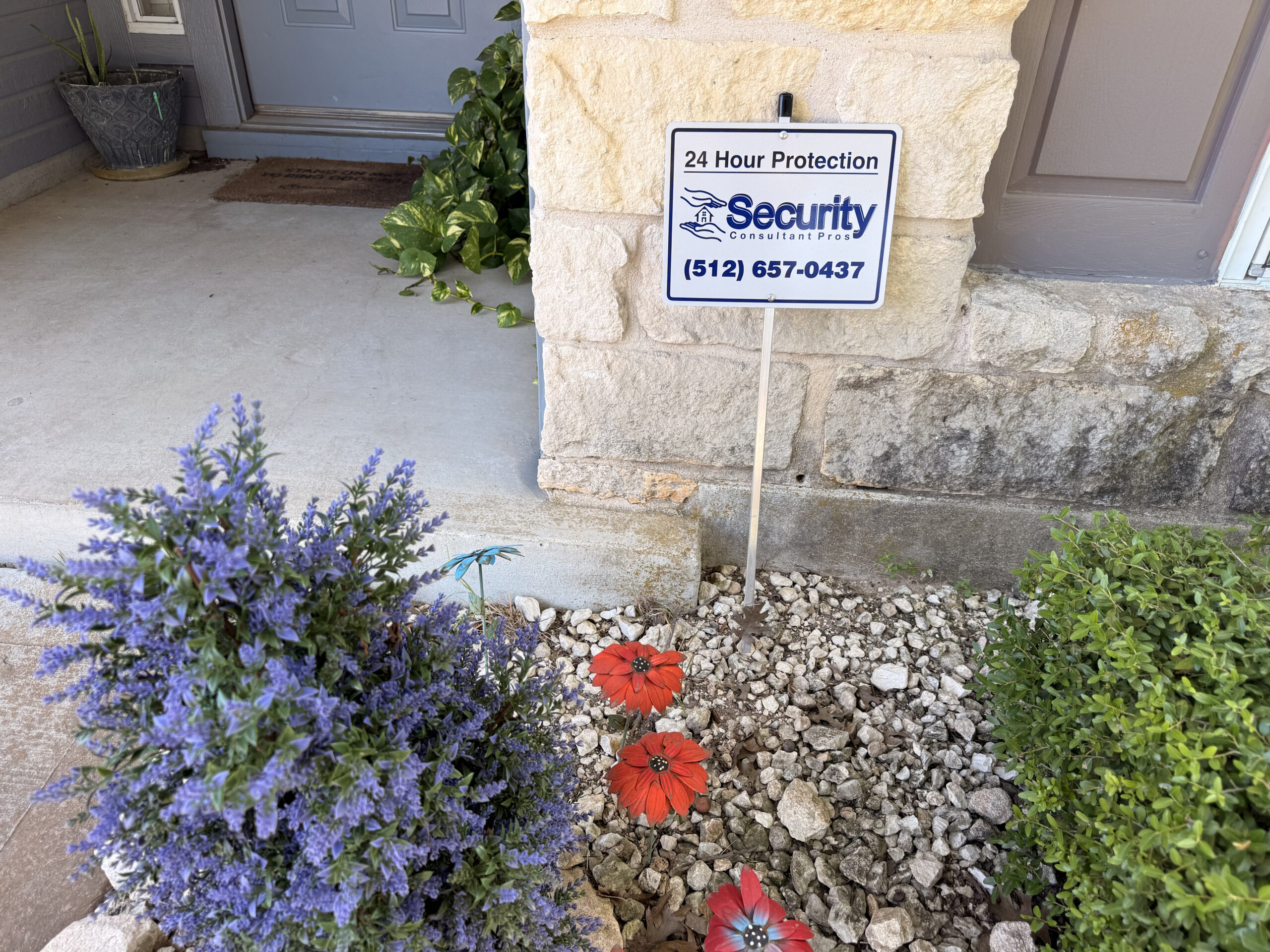 Security yard sign in front of a home